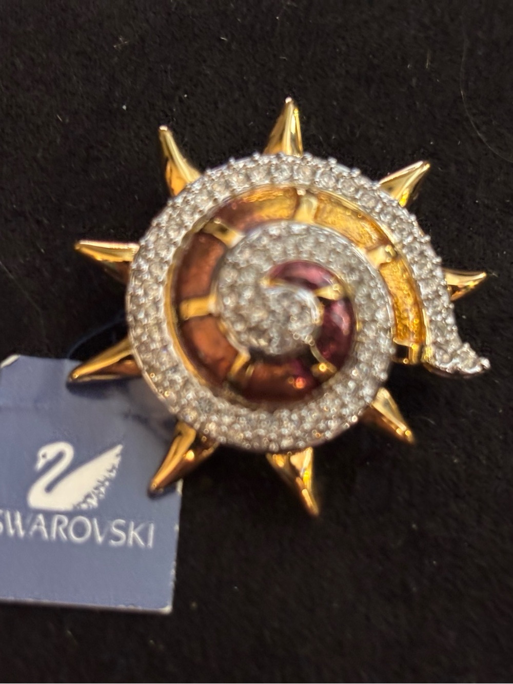 Swarovski Gold-Tone Spiral Sunburst Crystal Brooch with Burgundy Accents